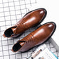 Men's pointed brown leather lace-up dress boots, showing lace rows and dark outsole
