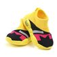 Kids yellow and black sock-style sneakers with pink and white stripes, rounded rubber sole