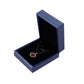 Dark blue PU leather jewelry box with open lid and red pendant necklace on black insert