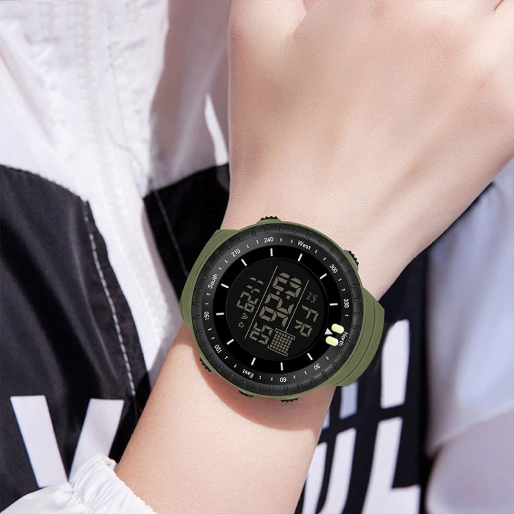 Men's electronic sports watch worn on wrist, green rubber strap and LED digital face