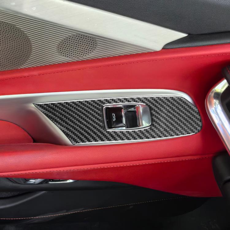 Close-up of carbon-fiber lift button trim sticker around switch controls