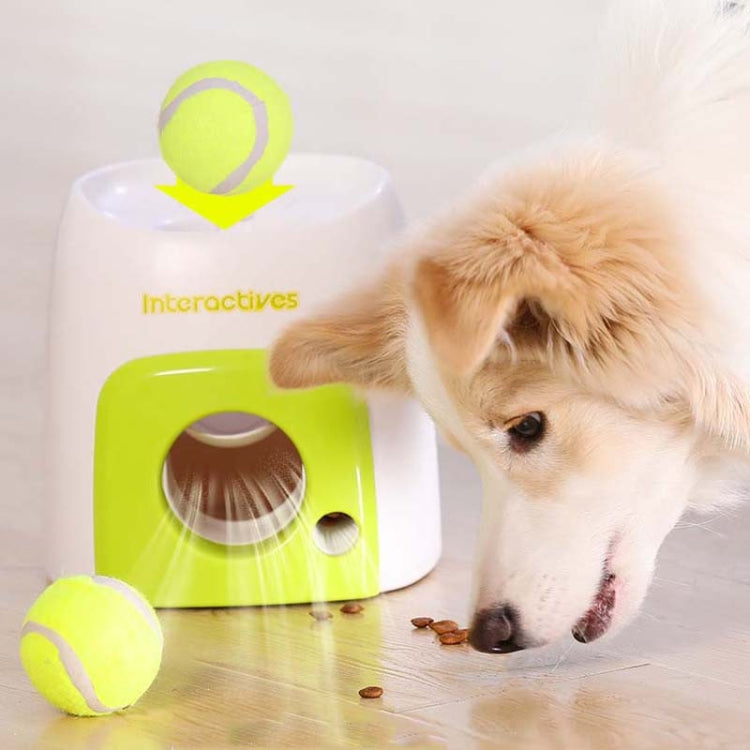 Green-and-white interactive dog food reward machine with tennis ball launcher and ball