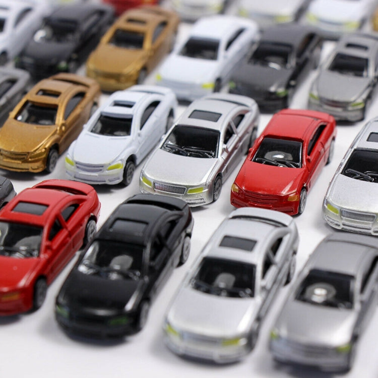 Close-up view of multiple small model cars in red, black, white, and gold