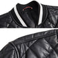 Close-up of black quilted baseball jacket collar and shoulder seam details