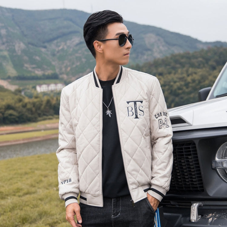 White quilted baseball jacket worn by a person, full-zip front with ribbed striped cuffs