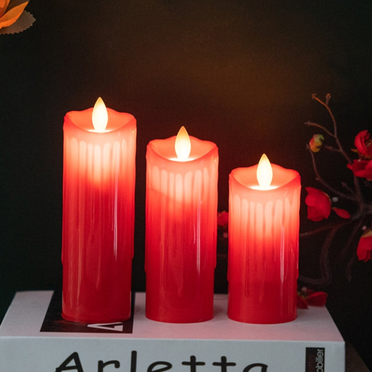 Three red LED flameless candles in a row, each with a glowing wick tip and ridged sides.