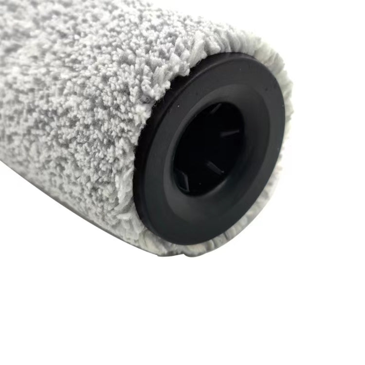 Roll brush roller end showing gray bristle pile and black wheel bracket