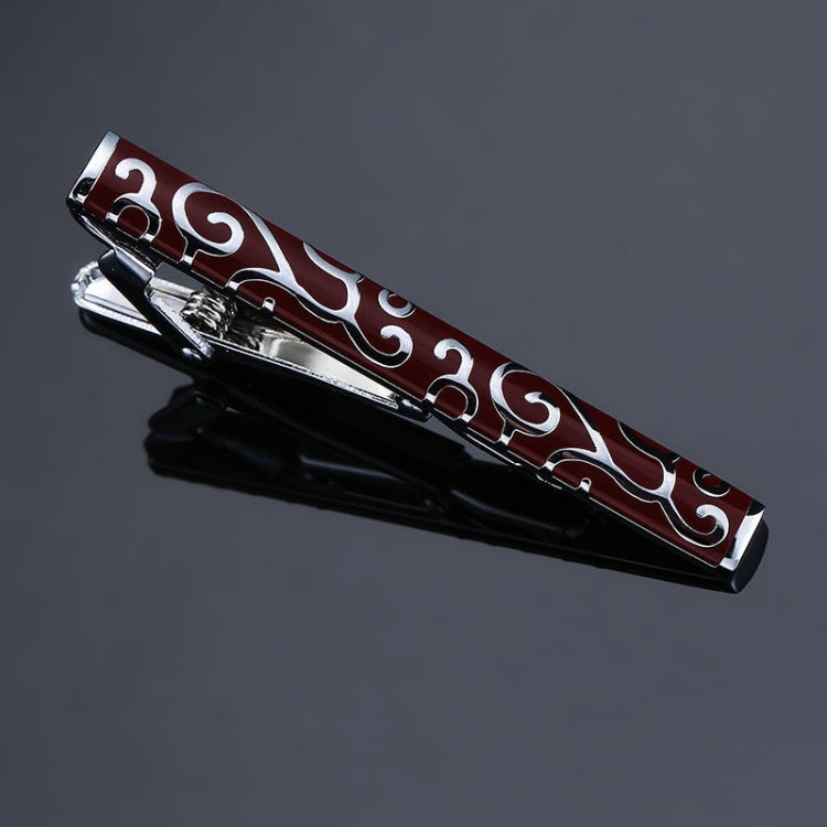 Black tie clip with burgundy red swirl pattern and silver-tone borders, hinged clasp.