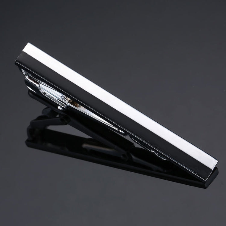 Black tie clip with wide white center bar and silver metal clasp, glossy finish.