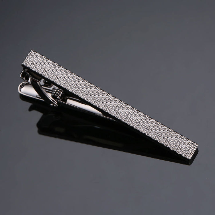 Black-and-silver tie clip with textured metal bar and hinged clasp