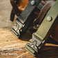 Close-up of woven belt with zinc-alloy buckle and textured fabric strap