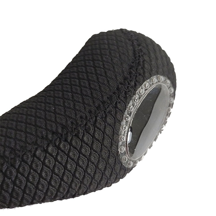 Black neoprene golf club head cover close-up, textured fabric with metal grommet trim