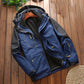 Men's blue outdoor jacket with hood, fleece lining, and zip front pocket with flap