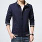 Men's dark blue jacket with chest pocket, zipper front, and striped hem band