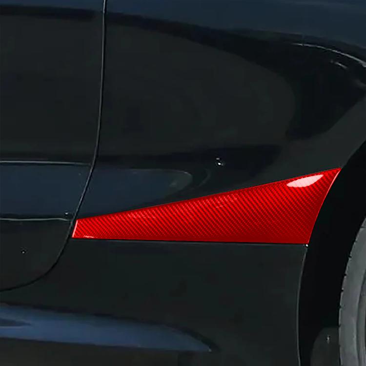 Red carbon-fiber style rear fender sticker installed on car quarter panel