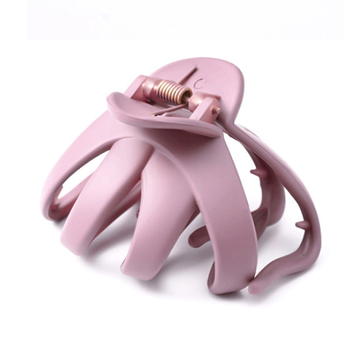 Pink frosted hair grab claw clip with spring hinge and wide teeth prongs