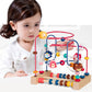 Multifunctional bead maze toy on wooden base with animal loop tracks, shown with child