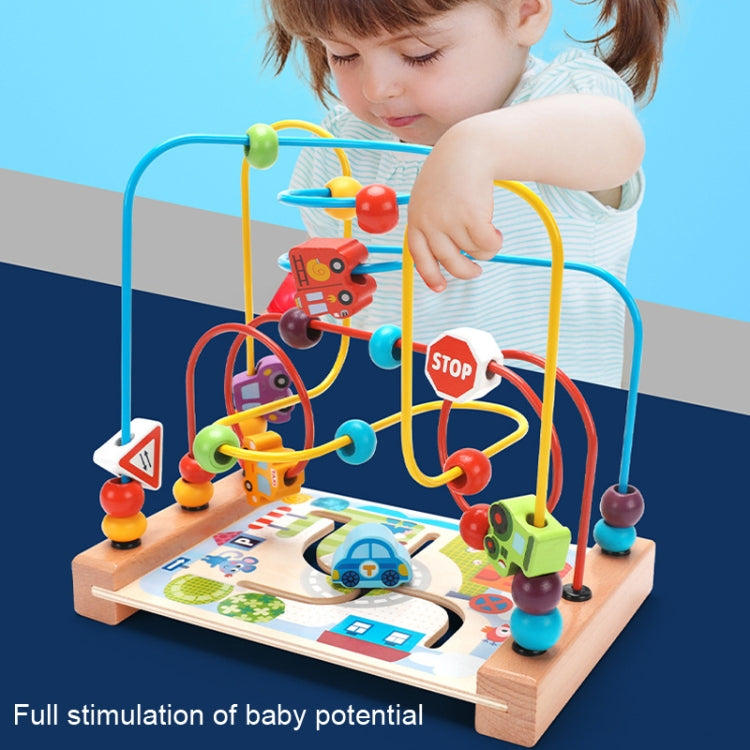 Wooden bead maze toy with colorful rails and road play mat, child reaching for beads