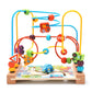 Wooden bead maze with vehicle and road-themed cutouts over a play mat