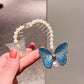 Blue butterfly hair clip with rhinestone star details, pearl frame, comb teeth, pearl drop