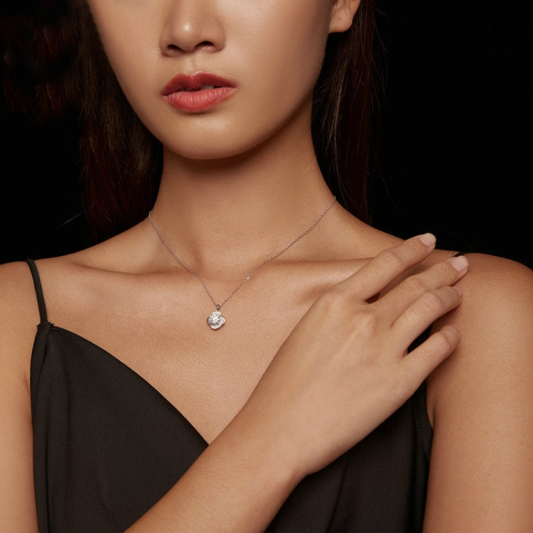 Moissanite pendant necklace worn on neckline, round sparkling halo pendant