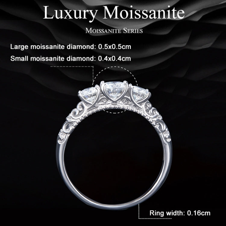 Sterling silver ring with ornate band and five round moissanite-style stones