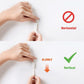 Hands attaching a white hook-and-loop picture strip to a wall