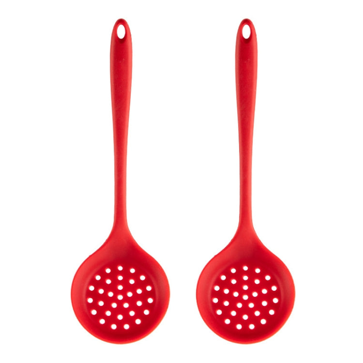 Red silicone slotted skimmer spoon with perforated head and loop handle.
