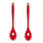 Red silicone pasta claw spoon with flame-shaped tips and loop handle.