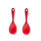 Red silicone rice spoon with rounded scoop head and loop handle.