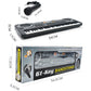 Boxed 61-key electronic keyboard toy with microphone accessory and speaker grille