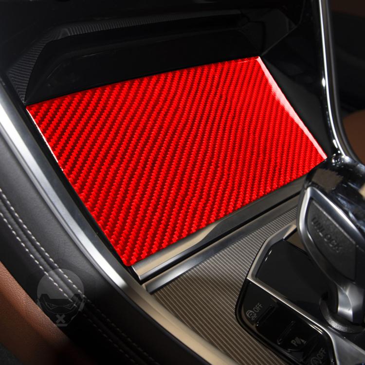 Red carbon-fiber style central storage box sliding panel sticker installed in console