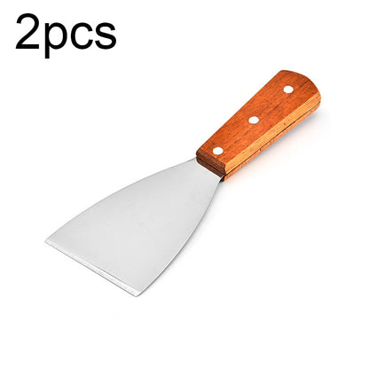 Small stainless steel pizza/steak shovel with wooden handle, slanted edge.