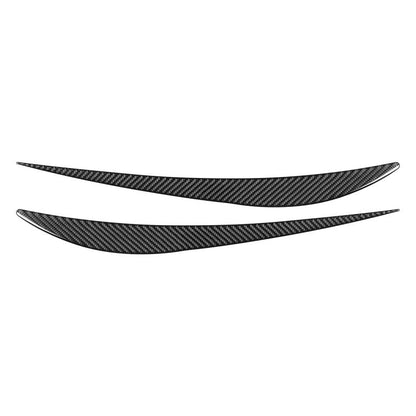 Black carbon-fiber headlight eyebrow sticker set, 2 curved strips