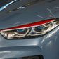 Red carbon-fiber headlight eyebrow sticker installed along the front headlight
