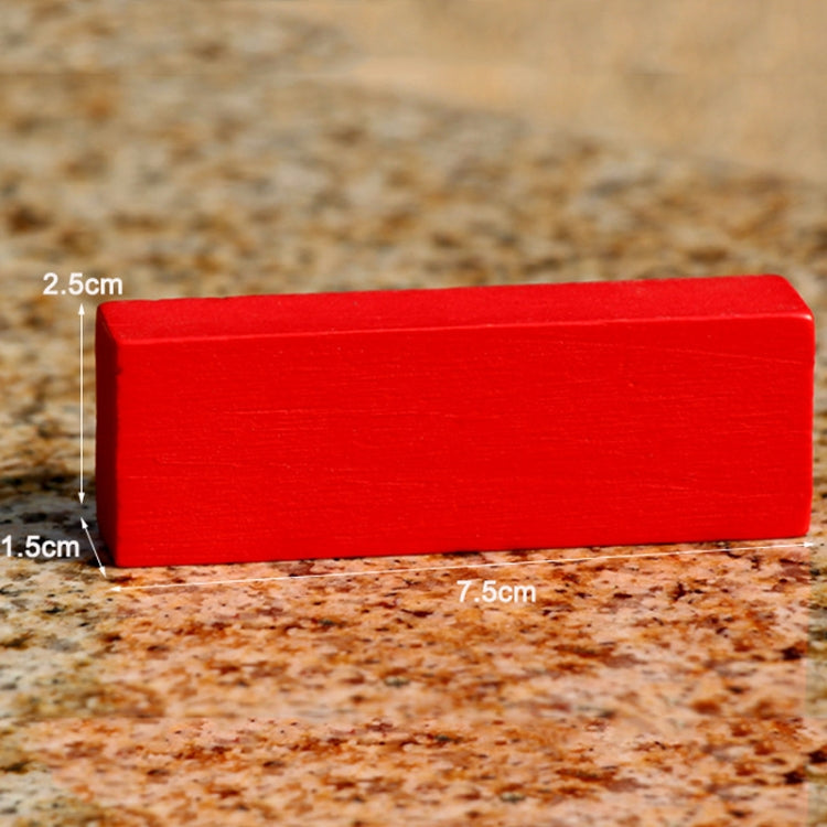 Red rectangular wooden game block piece with visible size markings