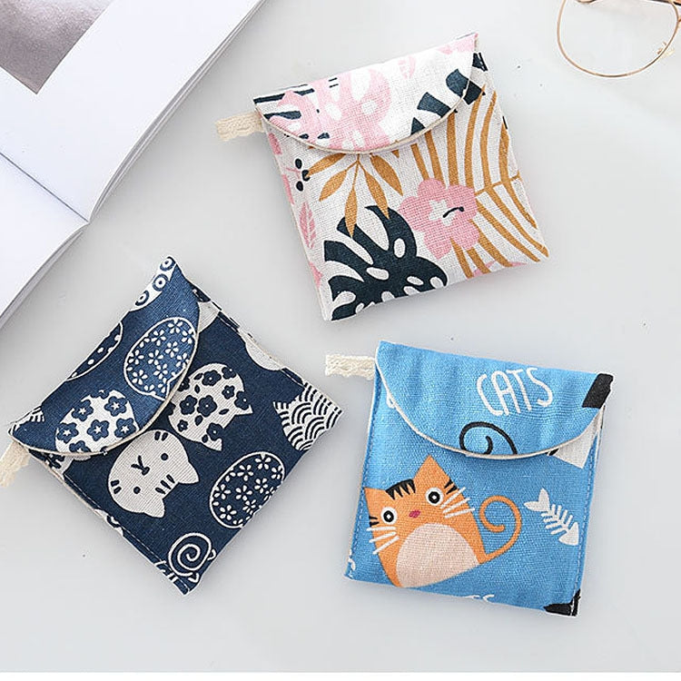 Set of animal-print cotton-linen storage pouches with snap front flaps