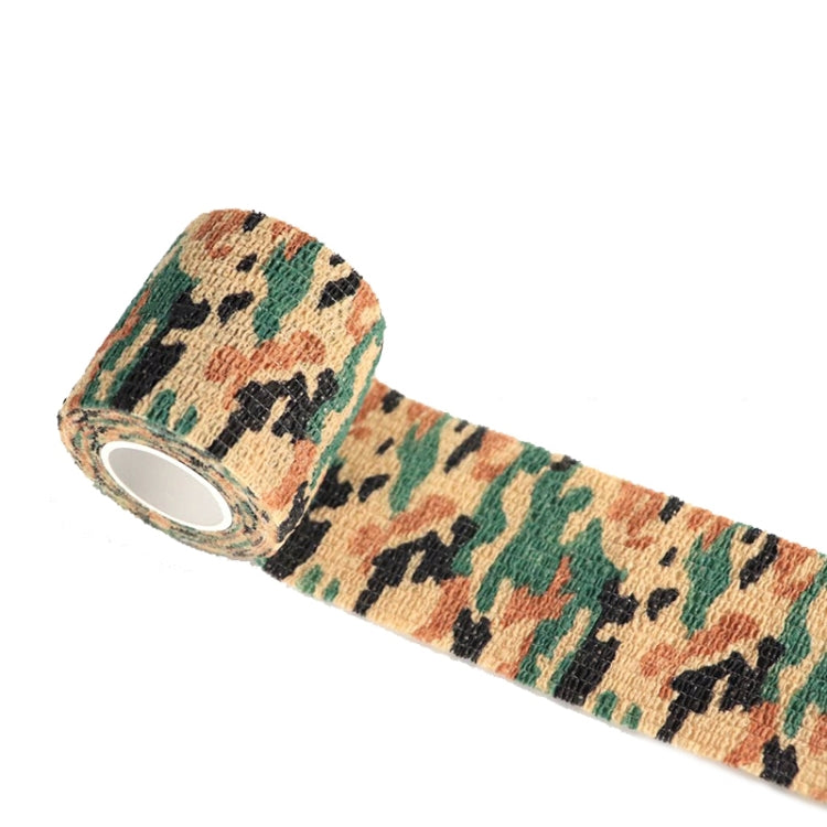 Orange and green desert camouflage self-adhesive tape roll with tan backing