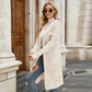 Beige long knit cardigan with textured zebra-like pattern, open front, long sleeves