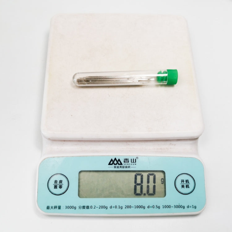 Stainless steel embroidery needle in clear storage tube with green cap