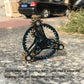 Blue-rim four-gear fidget spinner with gold-tone gears and dark center disc.