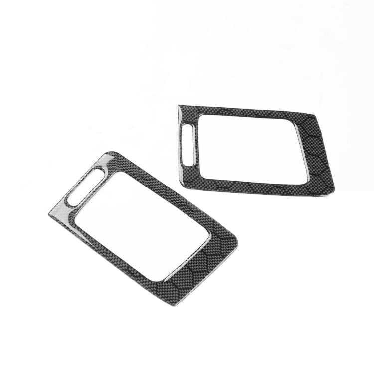 Two black carbon-fiber air vent outlet trim bezels with rectangular inner openings