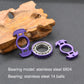 Purple nuclear-reactor fingertip gyroscope with exposed stainless-steel bearing