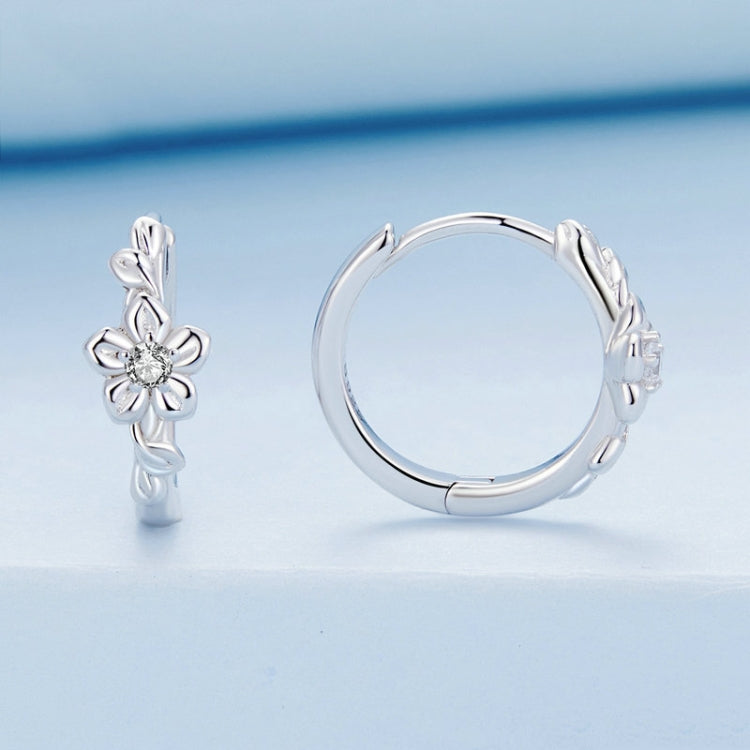 Sterling silver flower-vine hoop earrings showing hinge and zircon flower accent