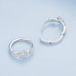 Sterling silver hoop earrings with flower-vine motif and round zircon centerpiece