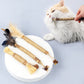 Assorted feather jute cat teaser sticks on plate, with cat pawing one toy