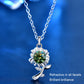 Silver sunflower pendant necklace with green round gemstone on a link chain