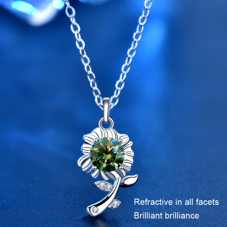 Silver sunflower pendant necklace with green round gemstone on a link chain