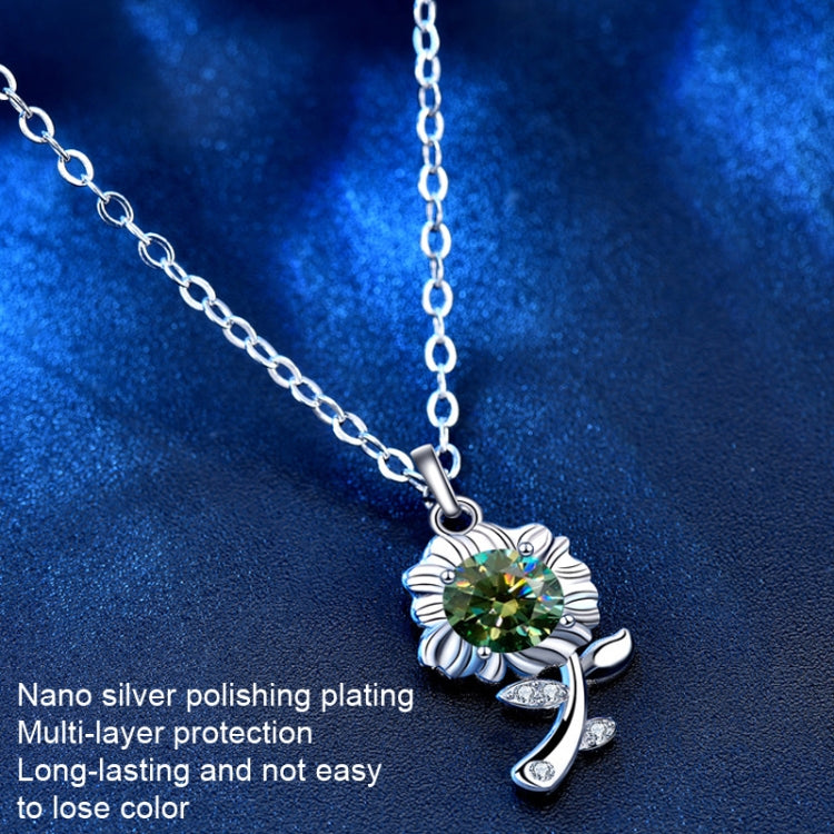 Silver sunflower pendant necklace with green round center stone, scalloped frame, and links