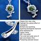 Silver sunflower pendant necklace close-up with green round gemstone and prong setting